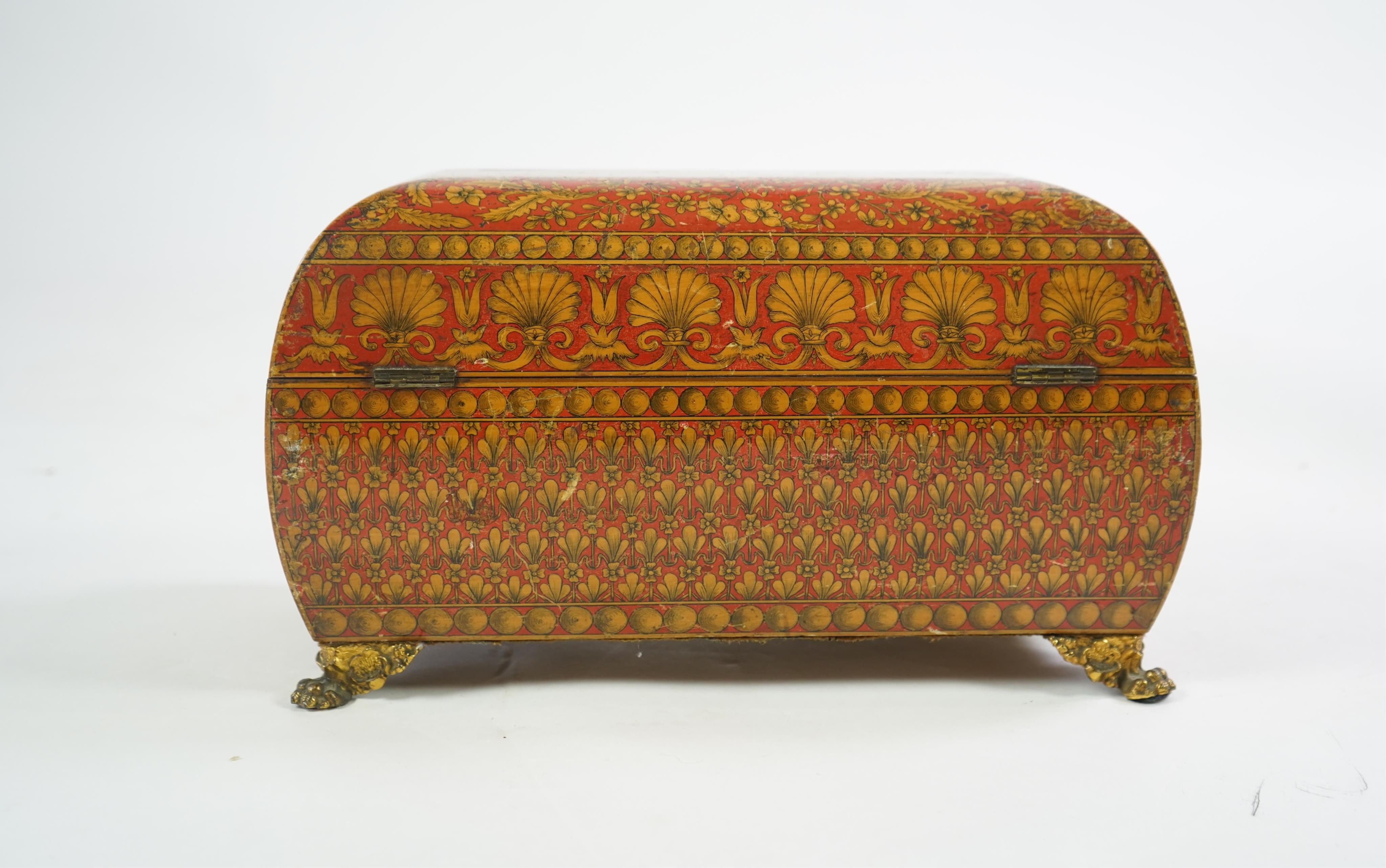 A Regency red lacquer penwork tea caddy